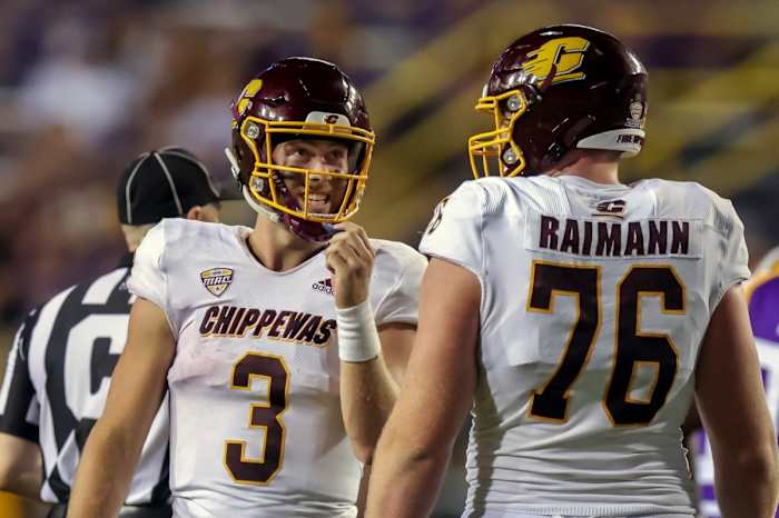 Central Michigan offensive lineman Bernhard Raimann with quarterback